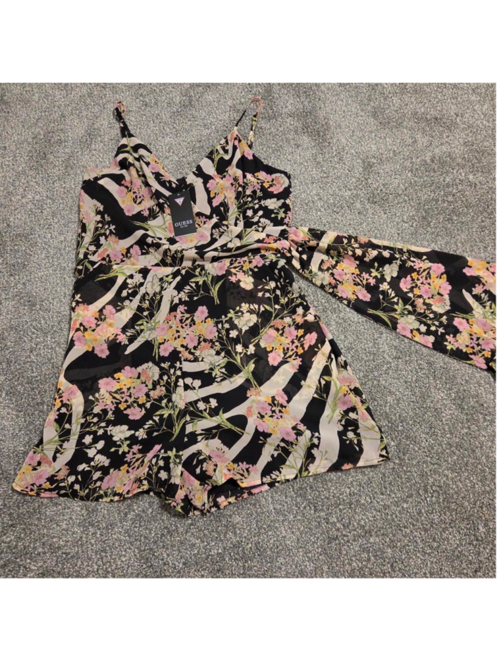 Guess NWT floral print romper with pink, white, and yellow flowers on black with